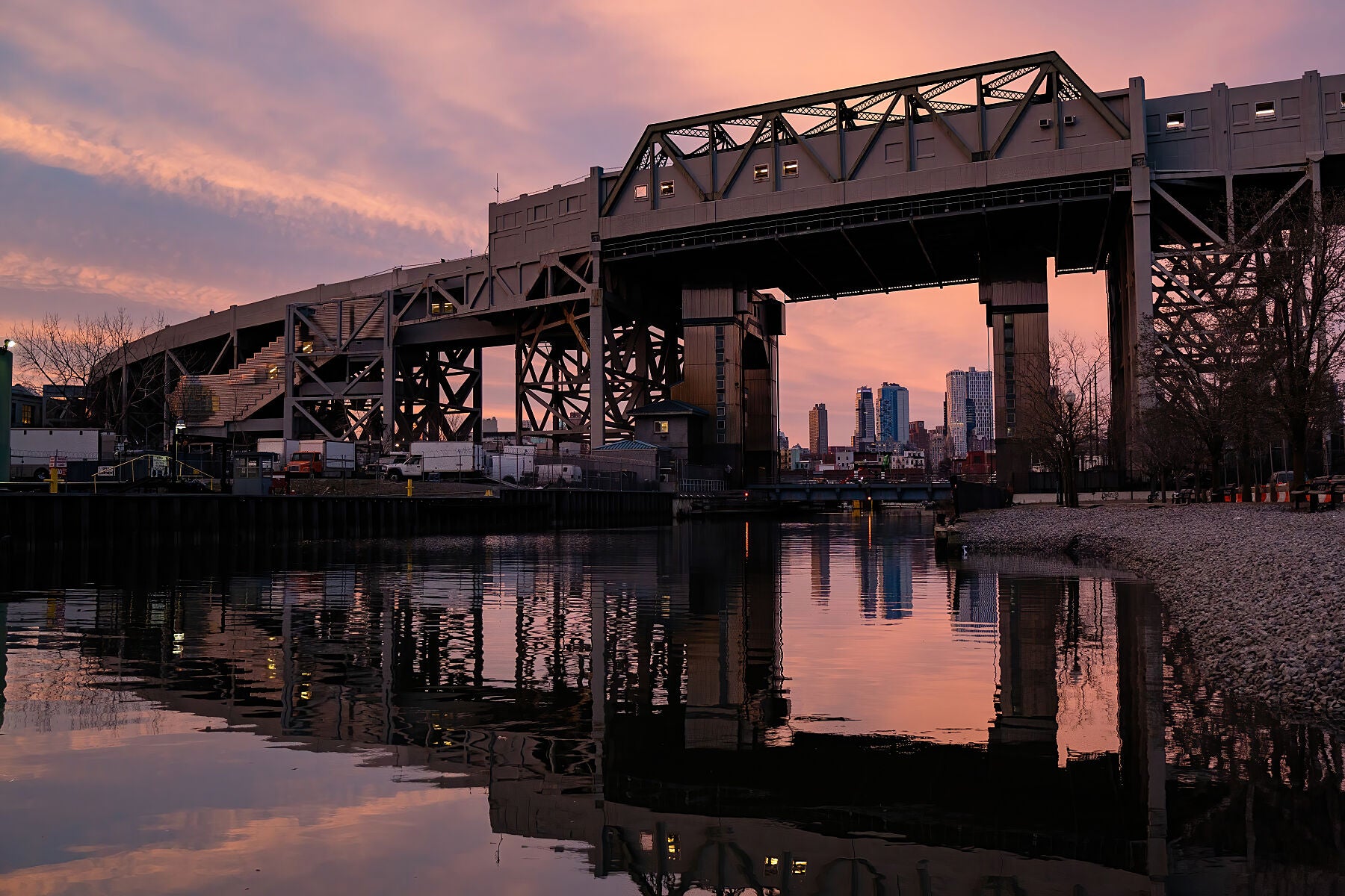 Sun set paints the sky pink behind the Smith & 9th St. subway station viaduct in Gowanus, Brooklyn